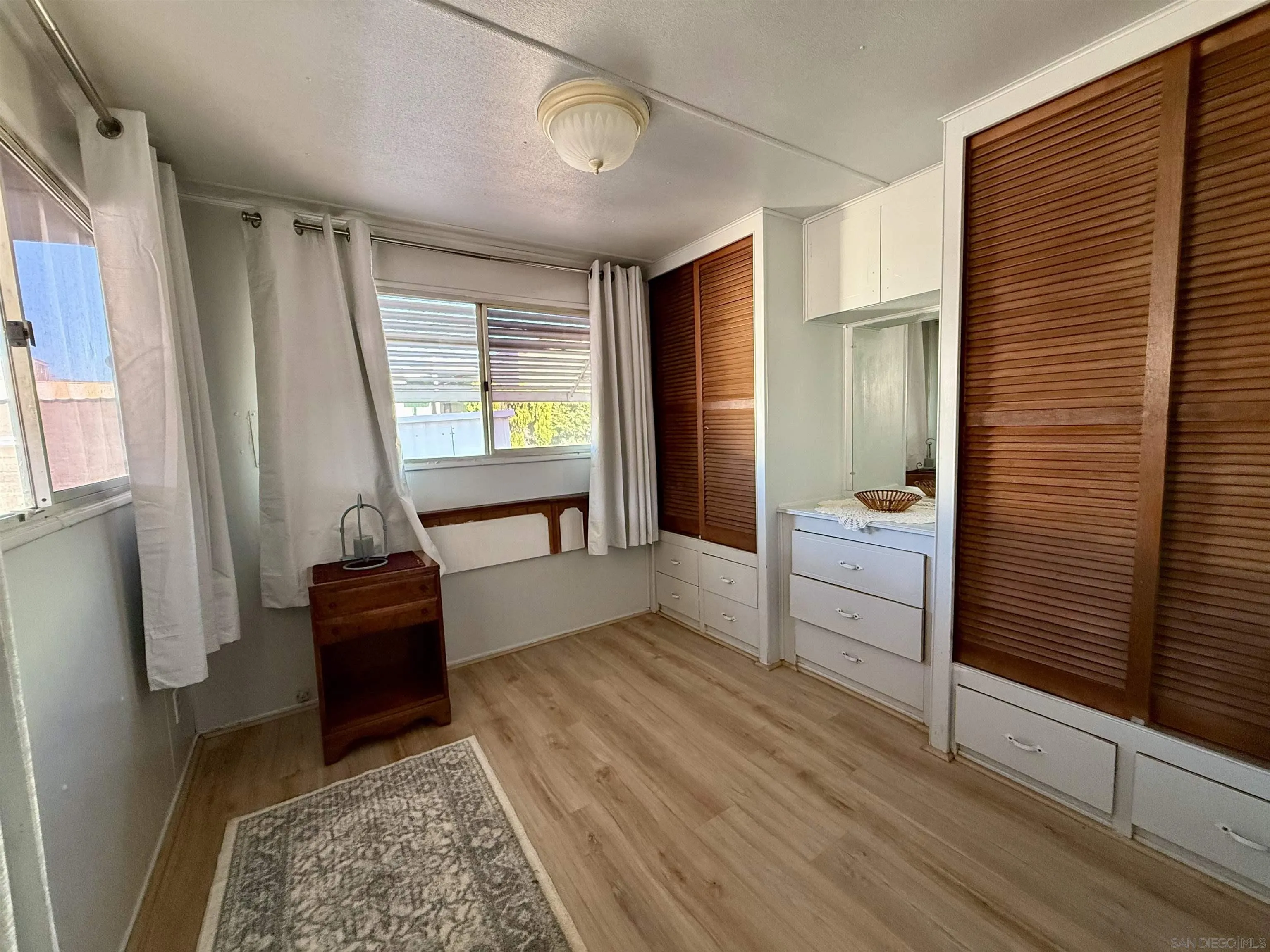 1174 East Main Street El Cajon, CA 92021 - Photo 19 of 23 a bedroom with furniture and a rug
