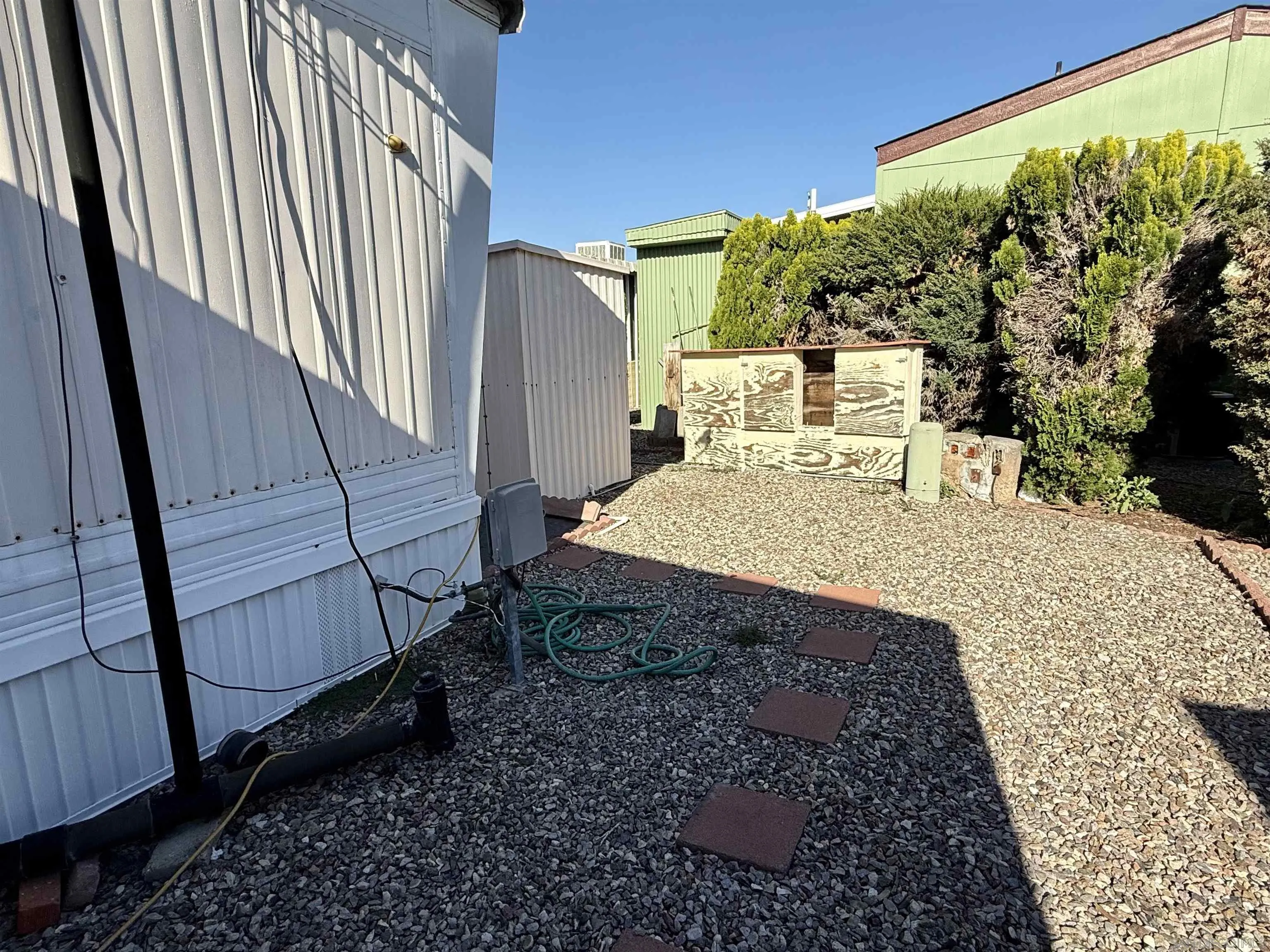 1174 East Main Street El Cajon, CA 92021 - Photo 4 of 23 a view of a backyard with pathway