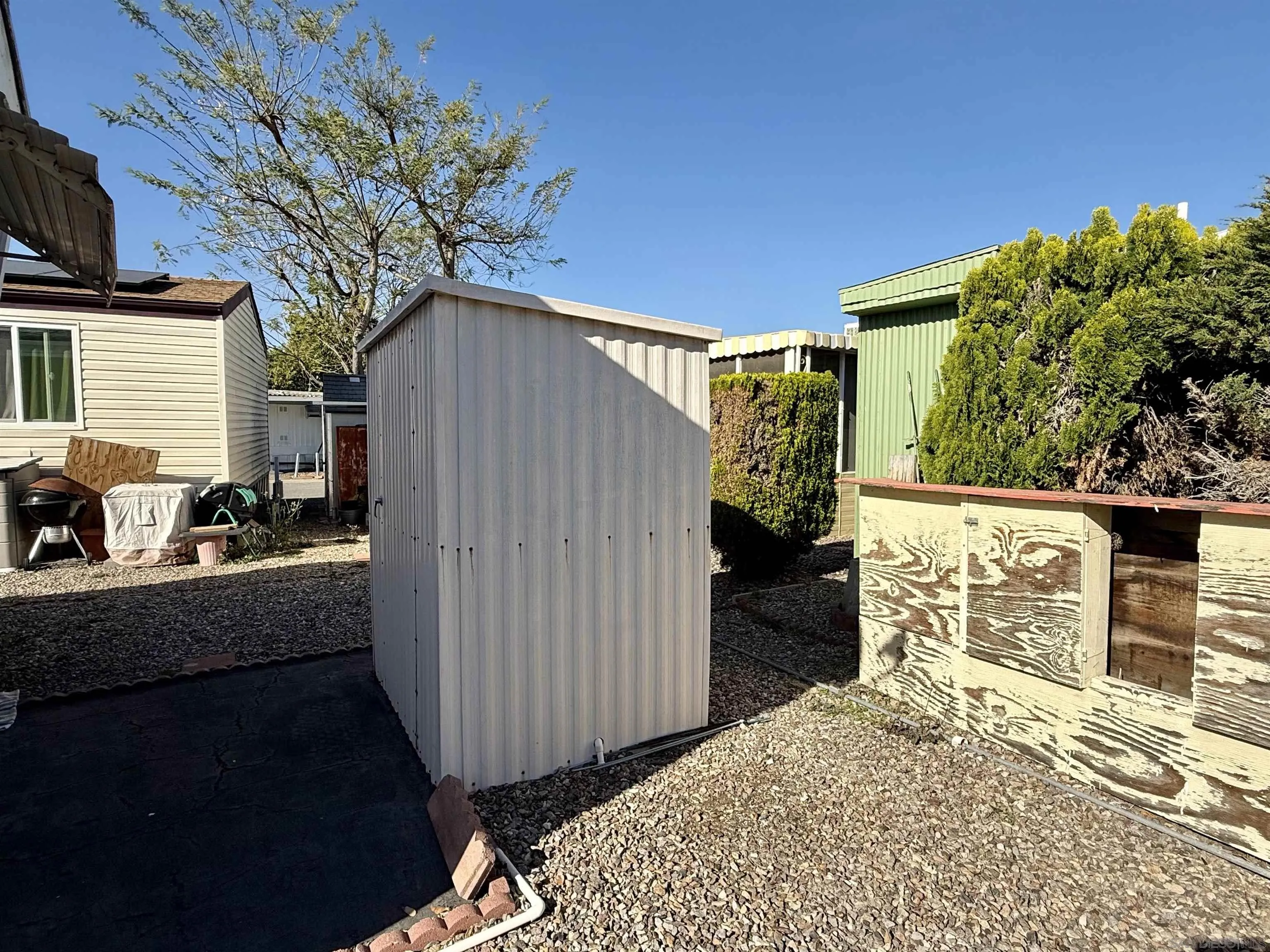 1174 East Main Street El Cajon, CA 92021 - Photo 5 of 23 a view of a house with backyard and sitting area