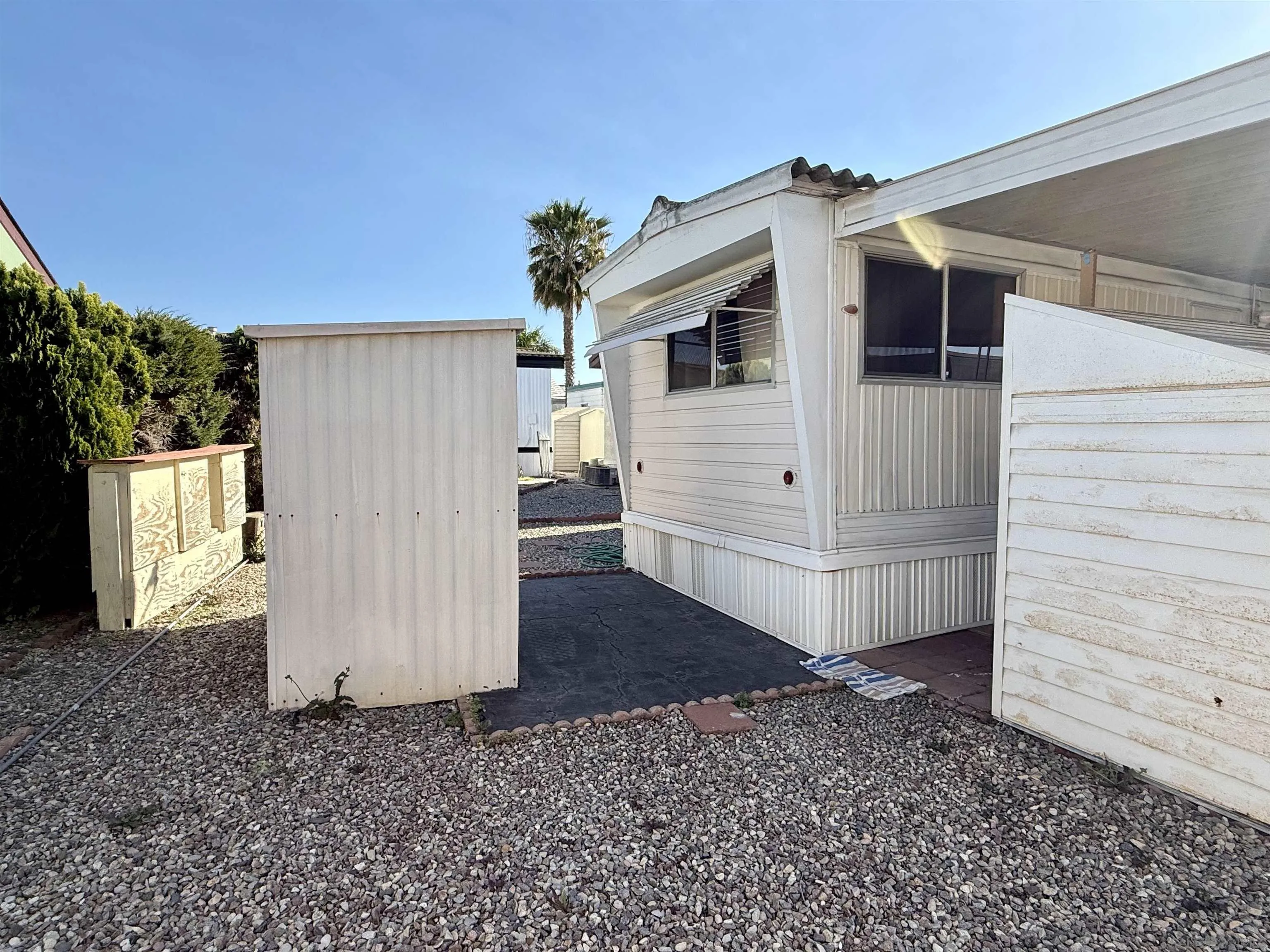 1174 East Main Street El Cajon, CA 92021 - Photo 6 of 23 a view of a house with a backyard