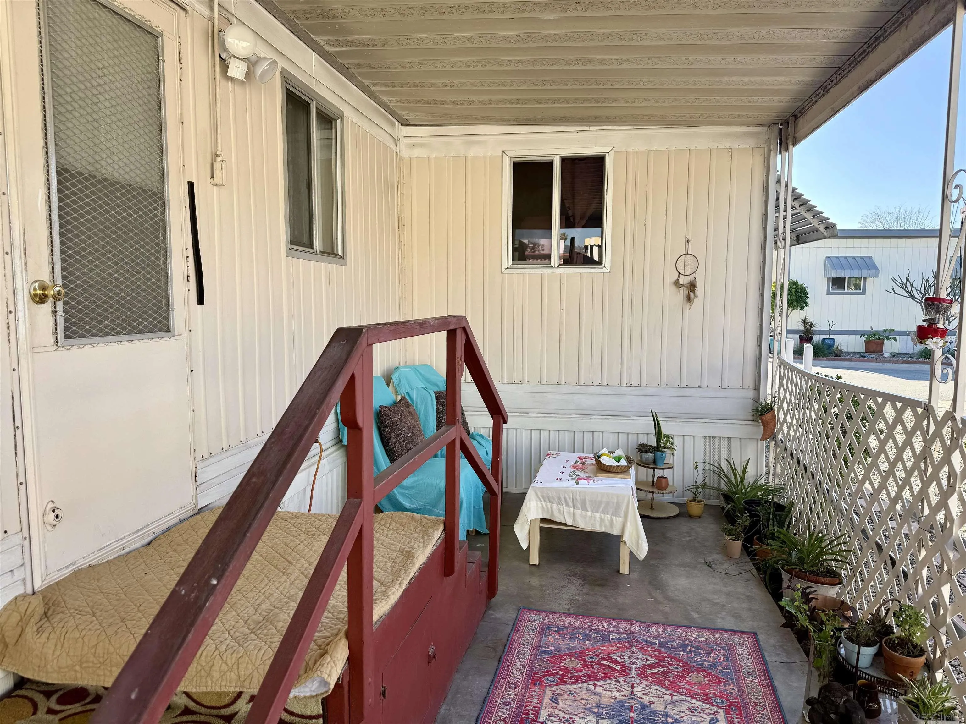 1174 East Main Street El Cajon, CA 92021 - Photo 7 of 23 a reading room with wooden floor and furniture