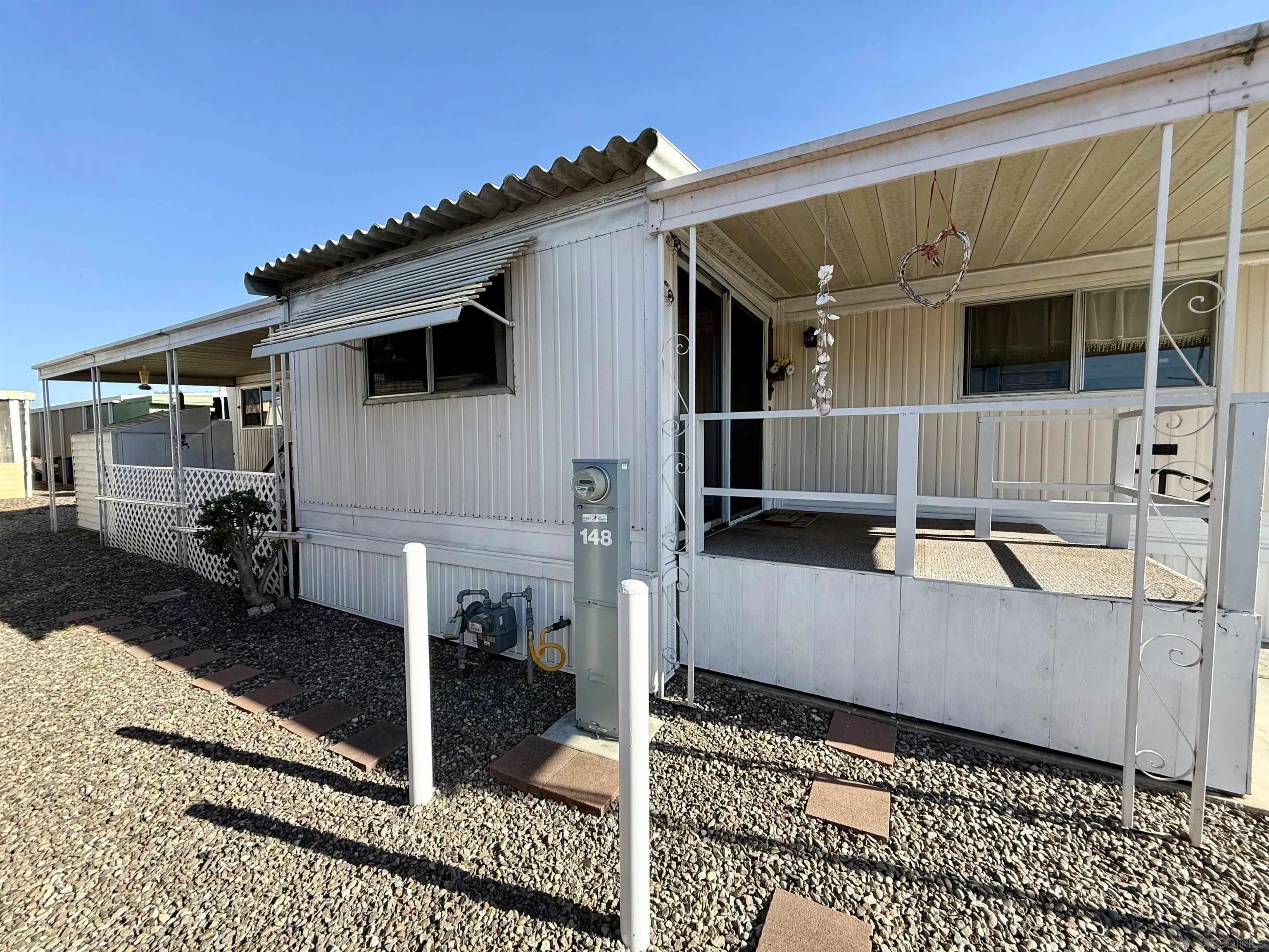 1174 East Main Street El Cajon, CA 92021 - Photo 9 of 23 a view of a house with a patio