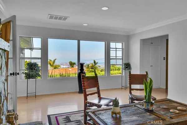a living room with furniture large window and a fireplace