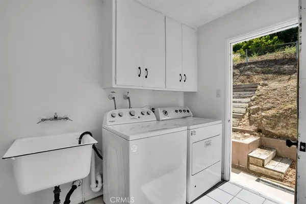 a bathroom with a bathtub a sink and a shower