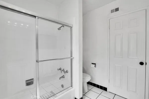 a bathroom with a shower and a bathtub