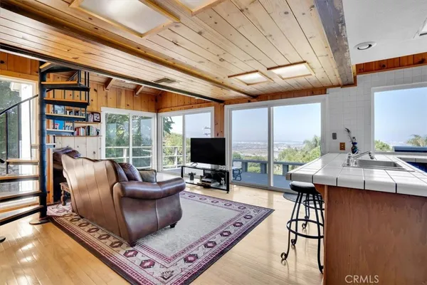 a kitchen with a stove a sink and a refrigerator