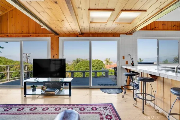 a spacious bathroom with a sink a mirror and shower