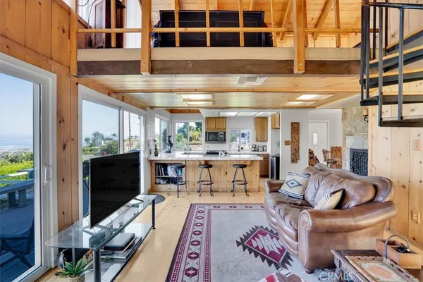 a view of a room with rack and wooden floor