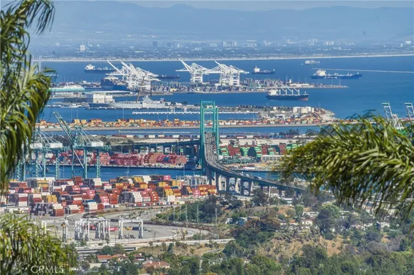 a view of a chairs and table in the balcony