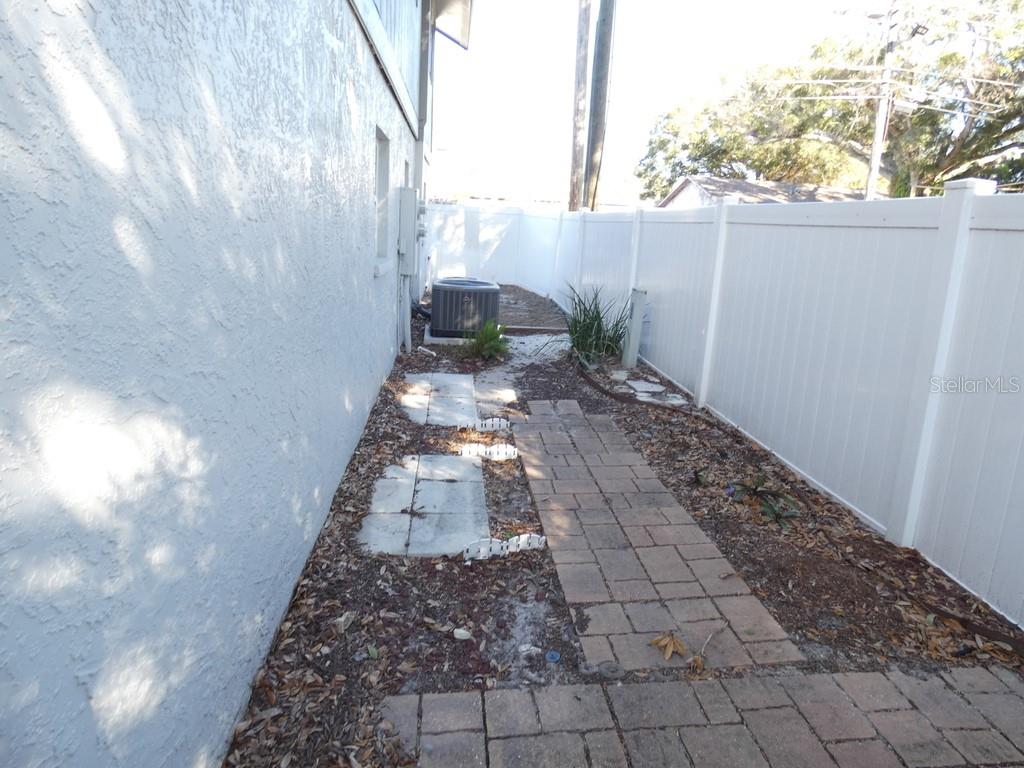 1960 Union Street, Unit 41 Clearwater, FL 33763 - Photo 12 of 45 a view of a yard with plants and a bench