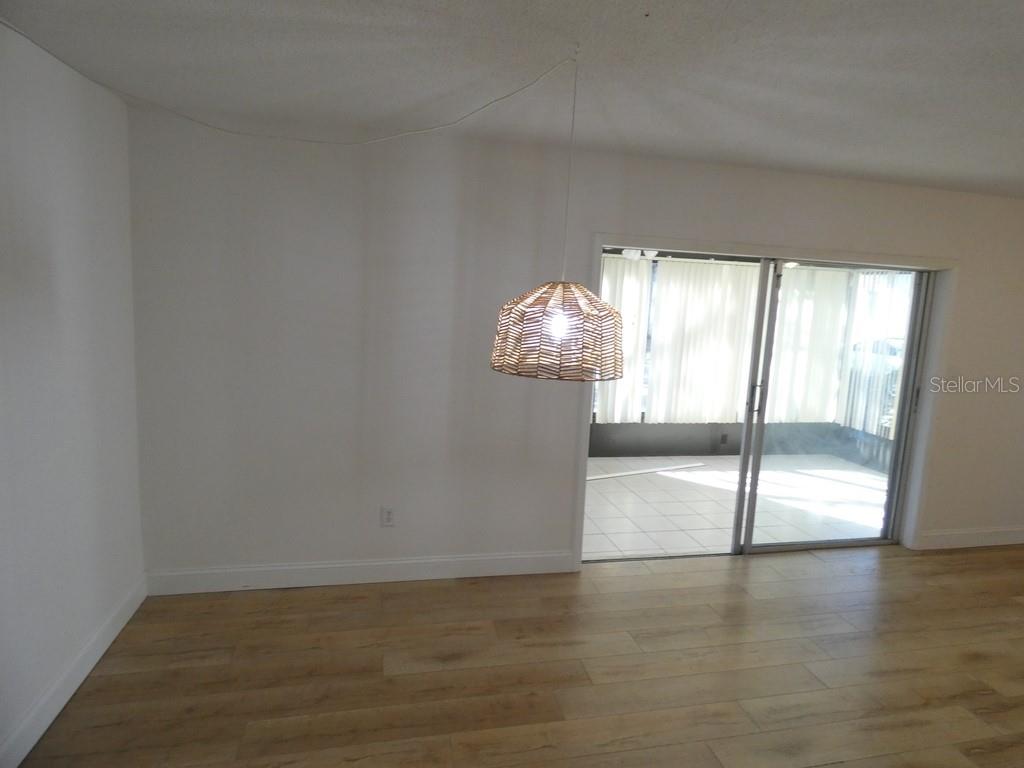 1960 Union Street, Unit 41 Clearwater, FL 33763 - Photo 14 of 45 a view of wooden floor and windows in an empty room