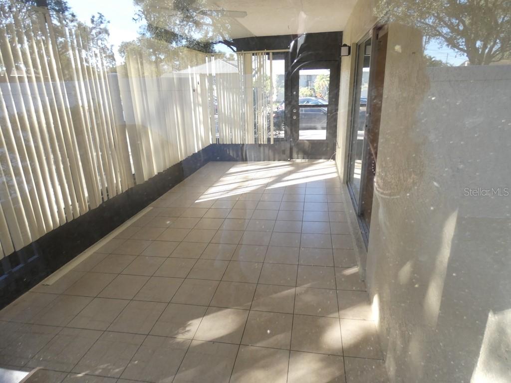 1960 Union Street, Unit 41 Clearwater, FL 33763 - Photo 17 of 45 a view of an empty room and floor to ceiling window