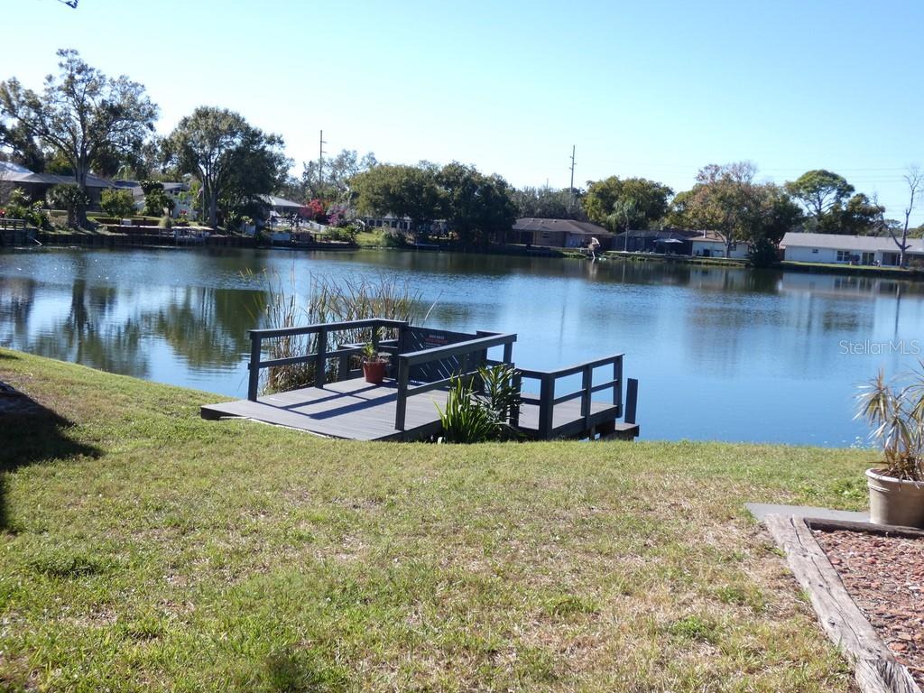1960 Union Street, Unit 41 Clearwater, FL 33763 - Photo 4 of 45 a view of a lake with houses in the back