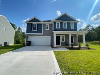 a front view of a house with yard and green space