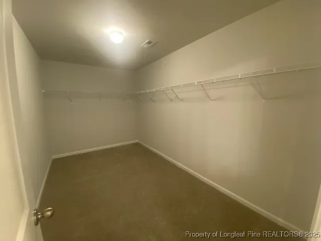 a bathroom with a sink toilet and a mirror