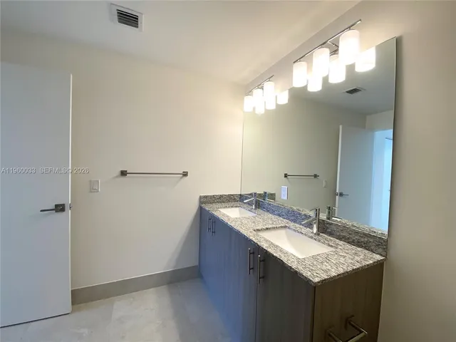 a bathroom with a shower and a toilet