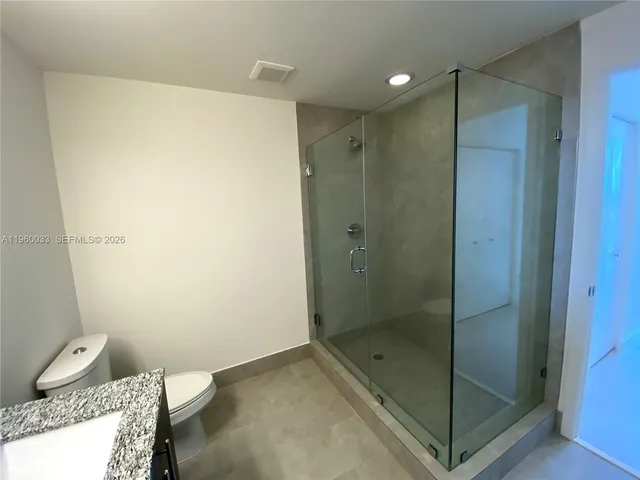 an aerial view of a residential houses with city view