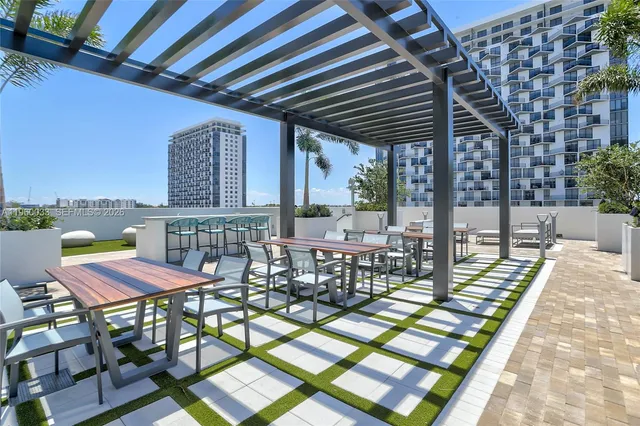 a view of a swimming pool with a patio and a garden