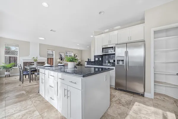 a kitchen with counter top space cabinets and stainless steel appliances