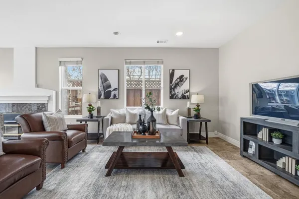 a living room with furniture and a fireplace