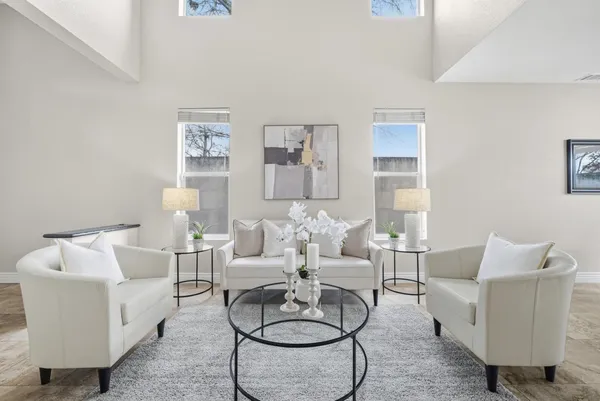 a living room with furniture and a large window