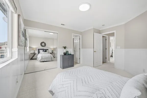 a bedroom with a bed and a fireplace