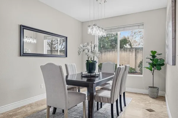 a view of a dining room with furniture window and outside view