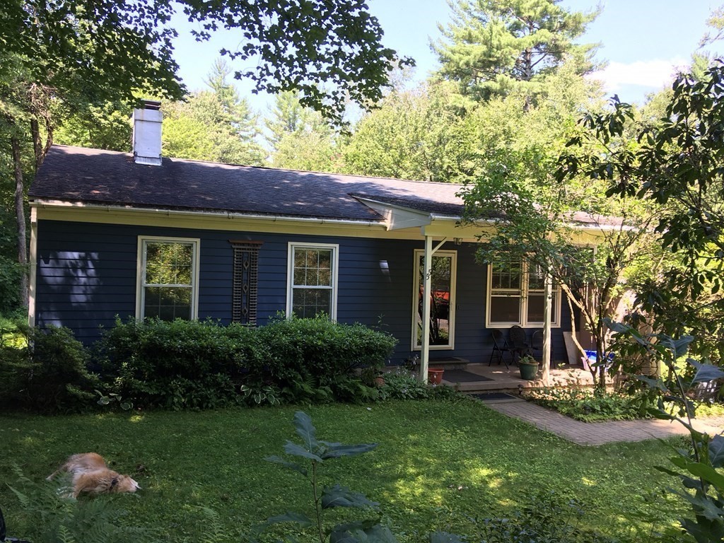 55 West Pelham Road Shutesbury, MA 01072 - Photo 1 of 32 a front view of a house with garden