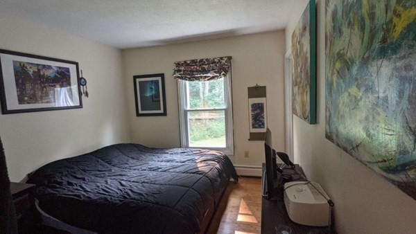 55 West Pelham Road Shutesbury, MA 01072 - Photo 21 of 32 a bedroom with a bed and a window