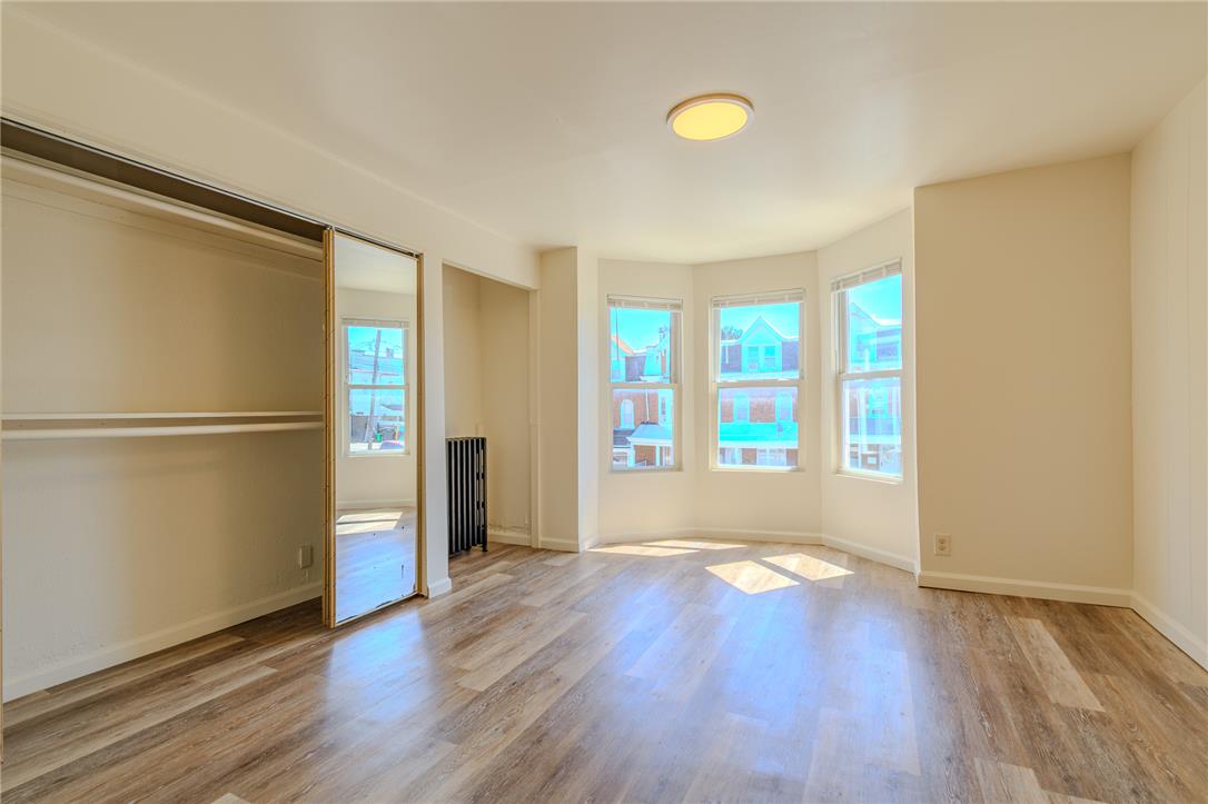 820 North 5th Street Allentown, PA 18102 - Photo 31 of 39 Sun-drenched interiors showcase beautiful hardwood-style flooring and mirrored closet doors.