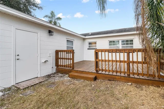 a view of backyard with deck
