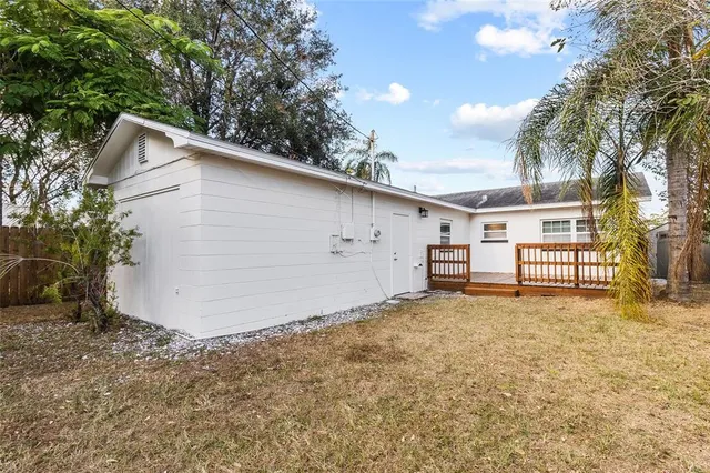 a view of a house with a yard and garage