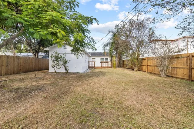 a view of a backyard of the house