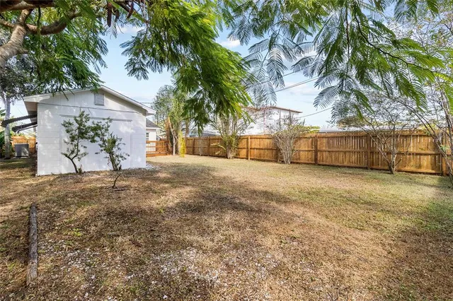 a view of a yard with a tree