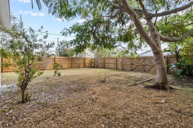 a view of backyard of a house