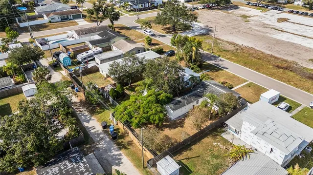 an aerial view of residential houses with outdoor space