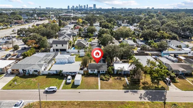 an aerial view of residential houses with outdoor space
