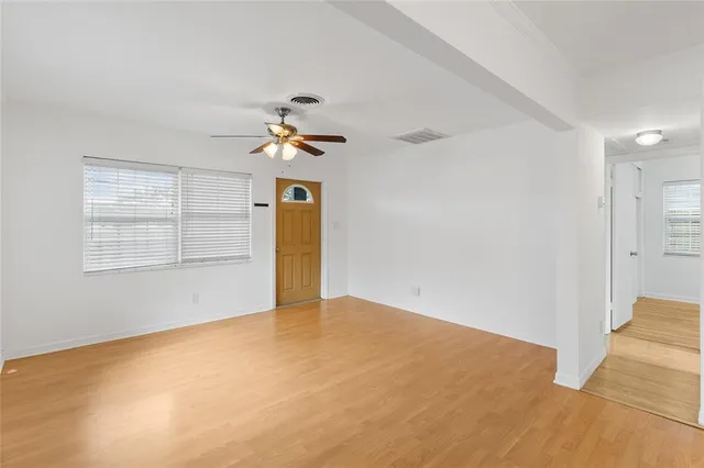 a view of an empty room with a window