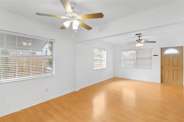 a view of an empty room with a window