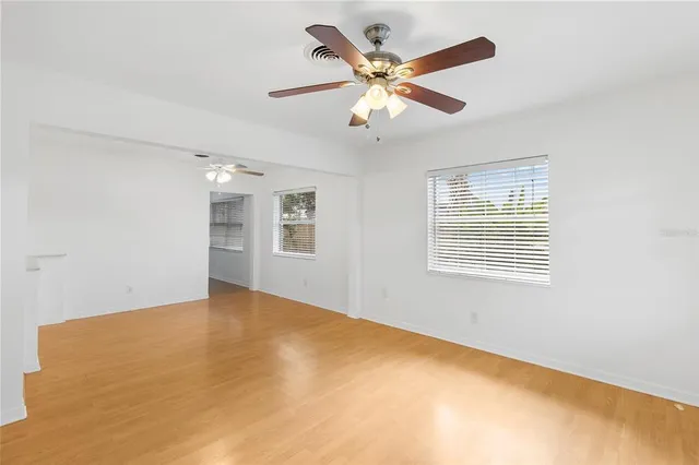 a view of an empty room with a window