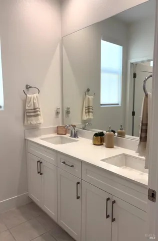 a bathroom with a toilet and a mirror