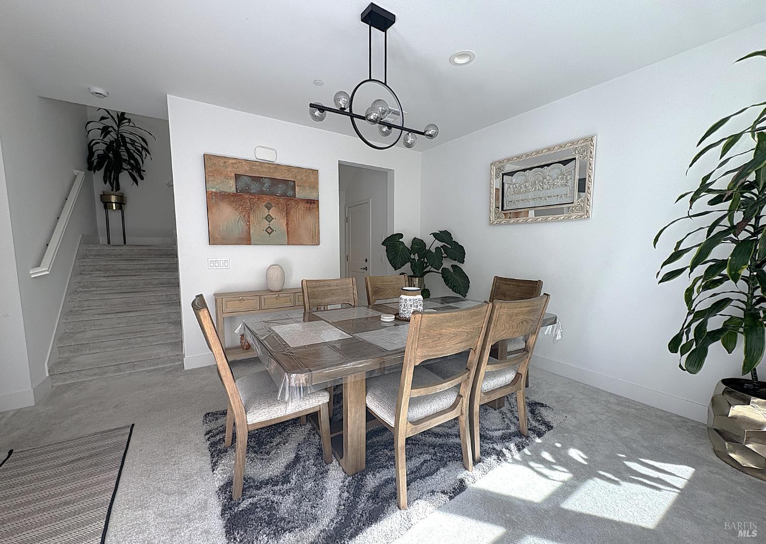 2912 Liscum Street Santa Rosa, CA 95407 - Photo 7 of 25 a view of a dining room with furniture wooden floor and a chandelier