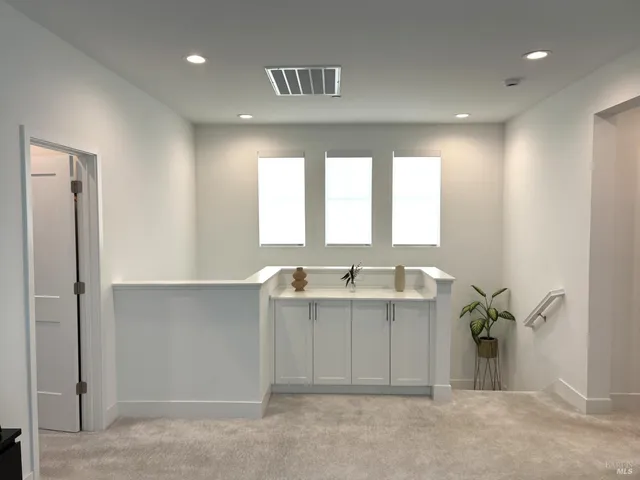 a spacious bedroom with a bed and window