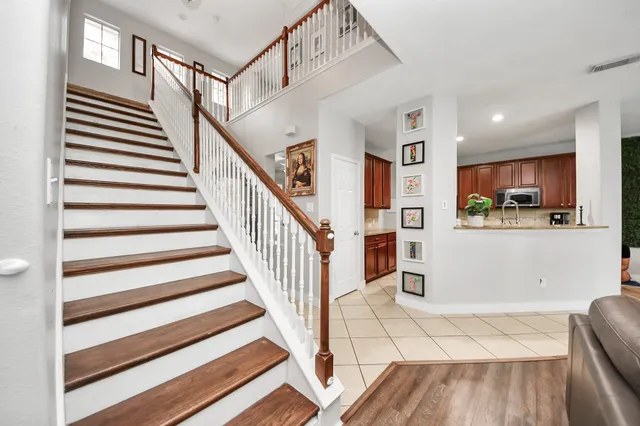 a view of a kitchen with furniture and staircase