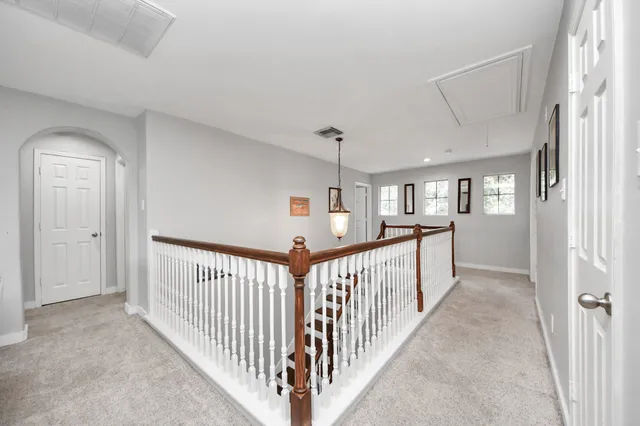 a view of a hallway with windows