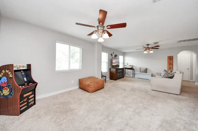 a living room with furniture and a window