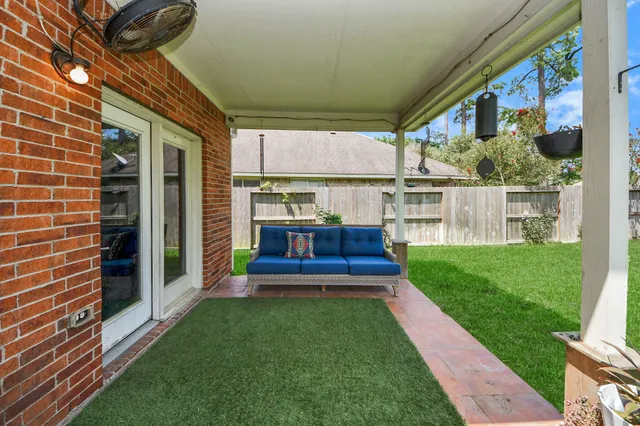 a view of house with a big yard
