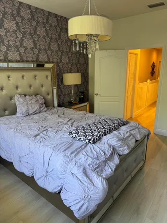 a bedroom with a bed and a table