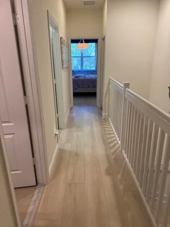 a view of a patio with table and chairs and potted plants