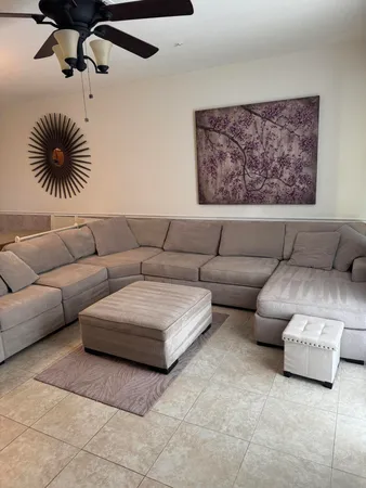 a living room with furniture and a couch